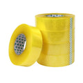 Stacked yellow packing tape rolls with printed inner core strips