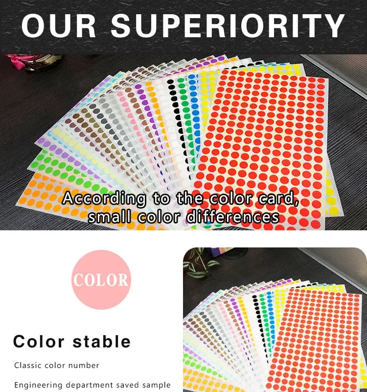 Assorted sheets of round color dot stickers laid on a surface in rows