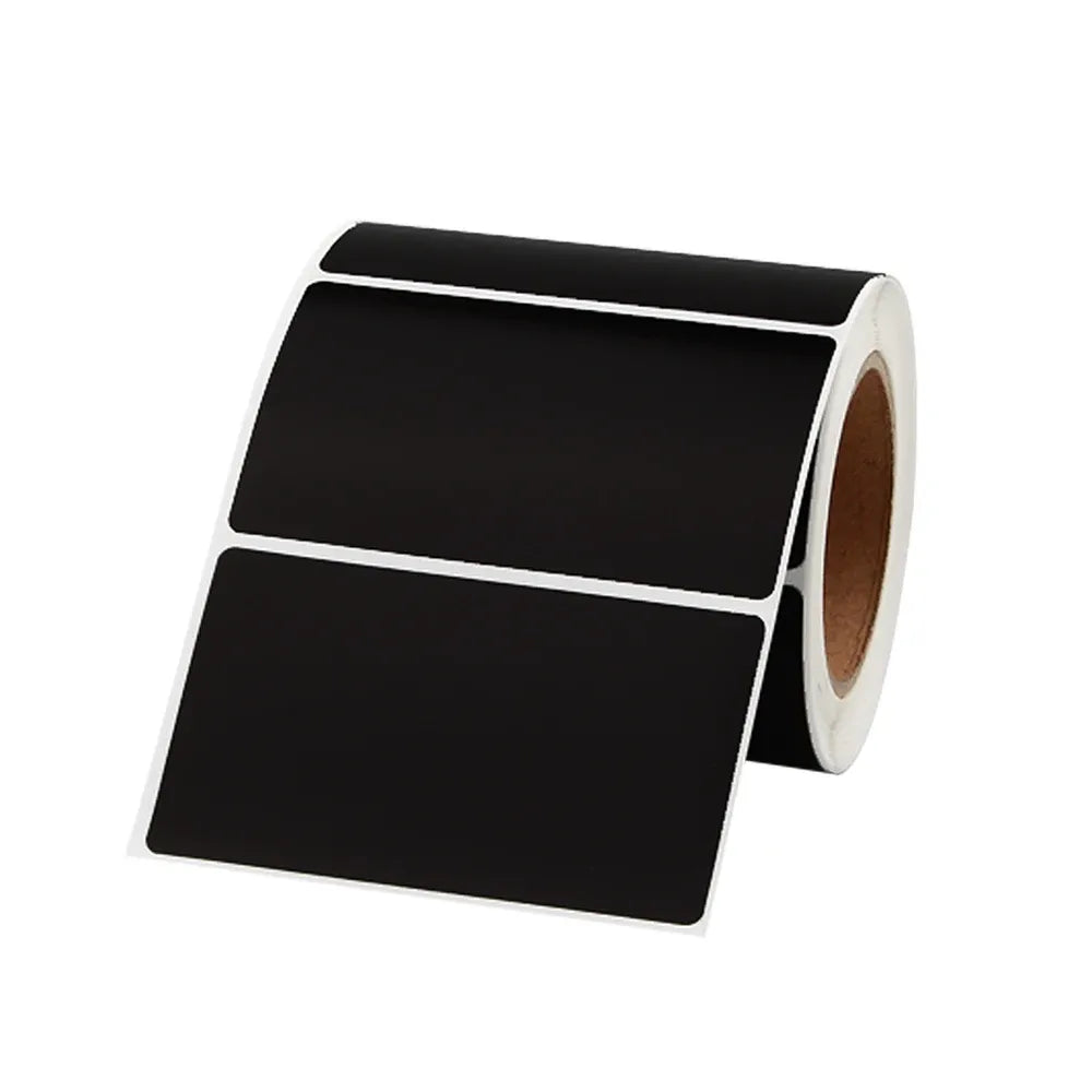 Black thermal label roll with two blank label sheets and release backing visible