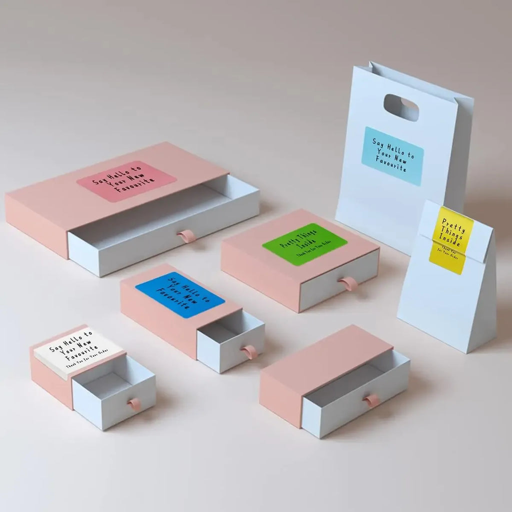 Direct thermal label stickers on small boxes, assorted label colors