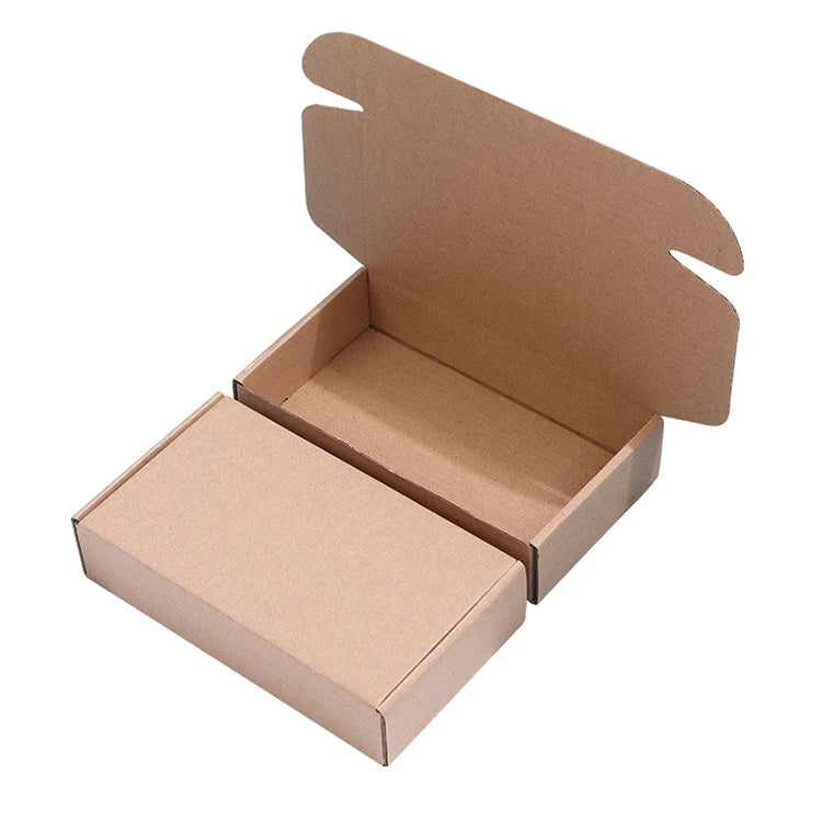 Brown corrugated cardboard mailer box, open with side and top flaps