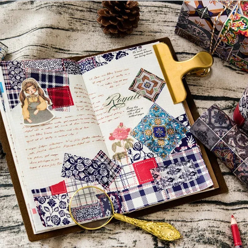Decorative masking tape strips in blue and red collage patterns on open paper