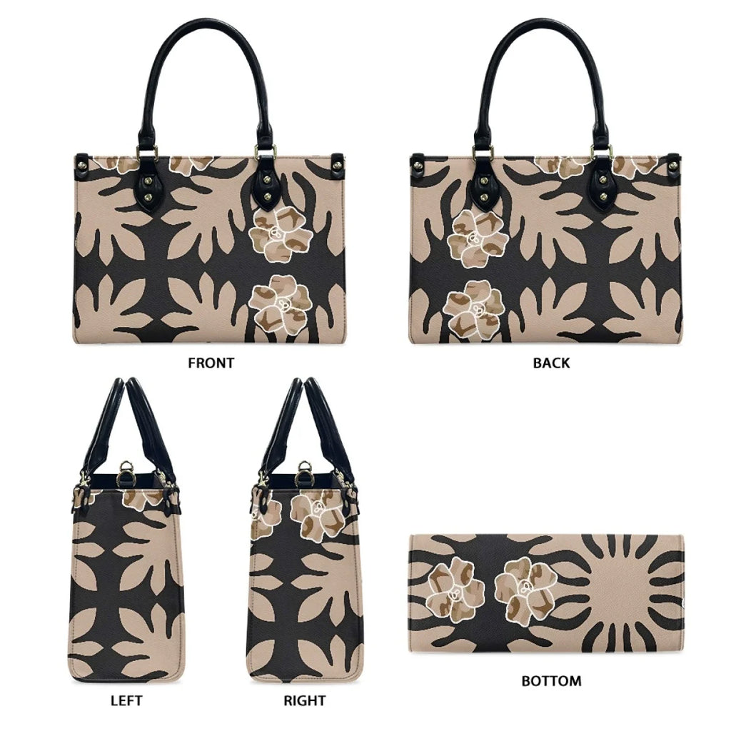 Black and tan leather luxury handbag with Samoan tribal floral pattern, shoulder strap, and trunks style design.
