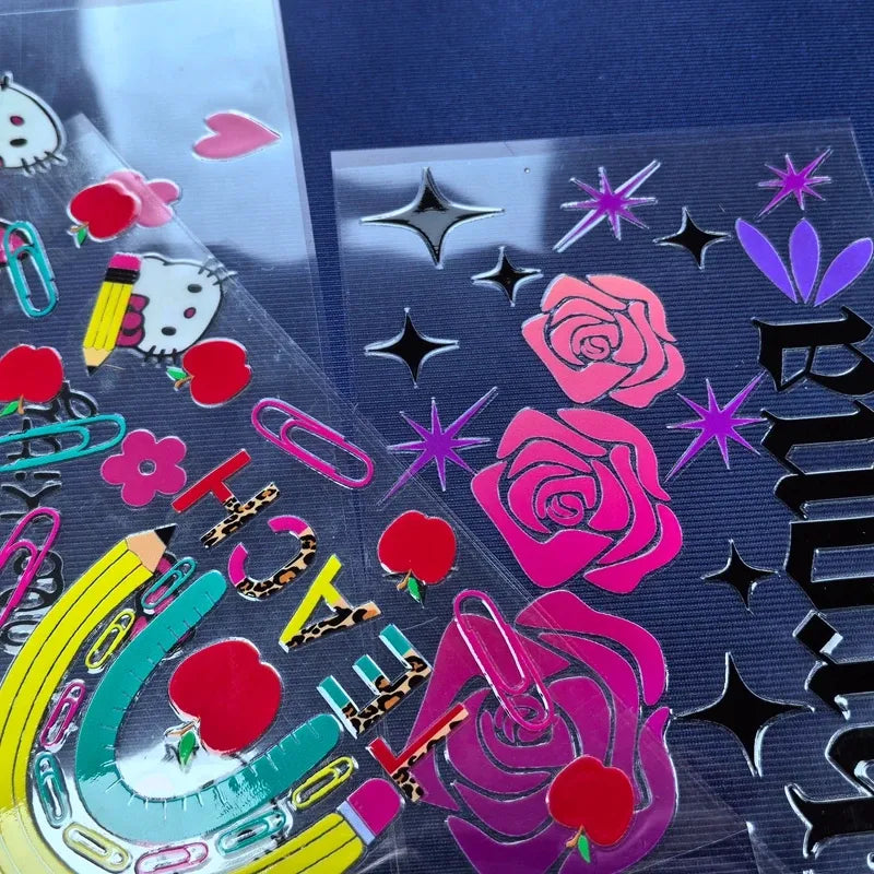 Waterproof die-cut vinyl sticker sheet with pink roses, hearts, and starburst accents