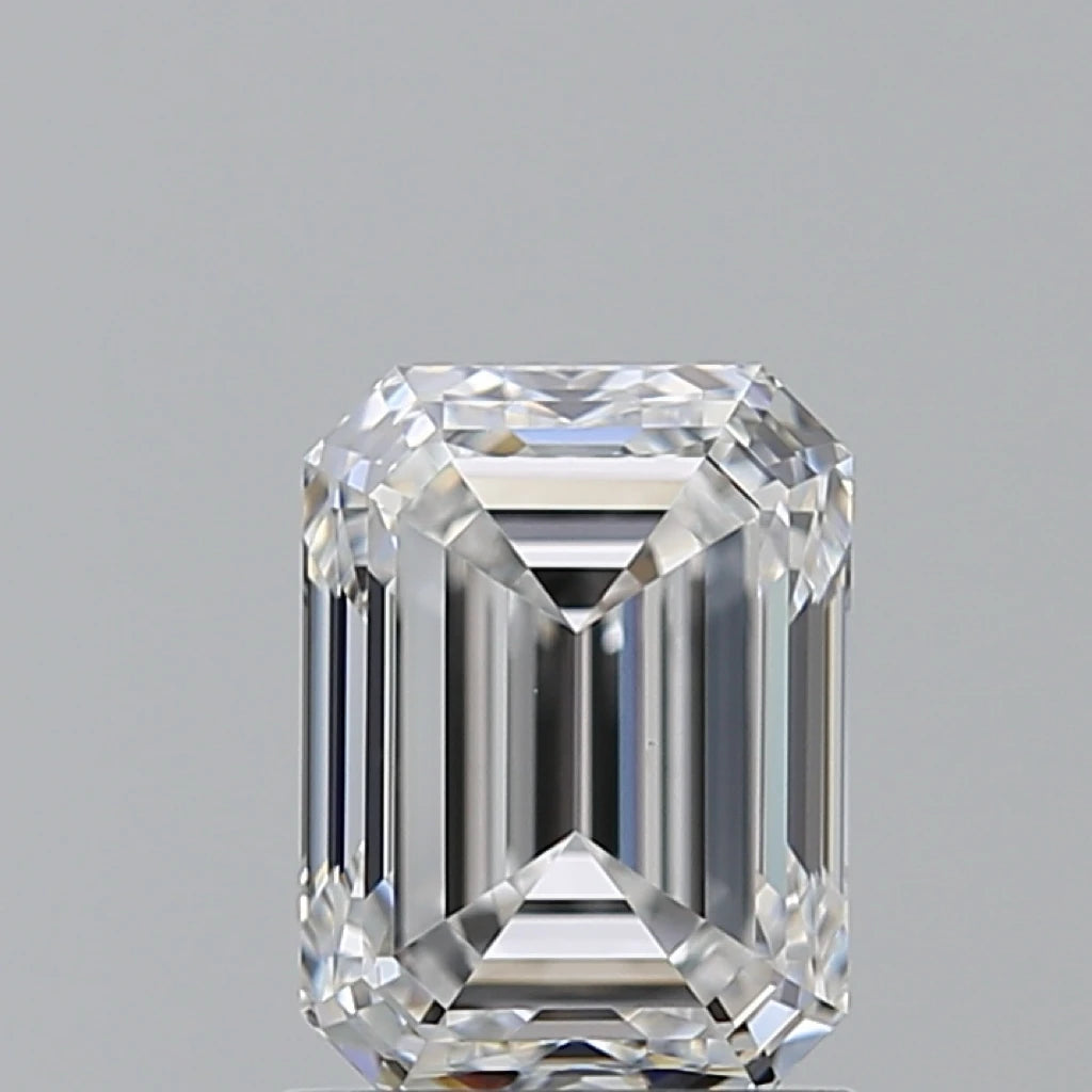 Emerald-cut diamond, prongless view, bright facets and rectangular step cuts, loose stone.
