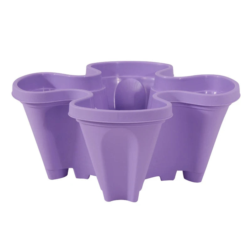 Stackable plastic flower pot set in purple, three connected vertical planters with central pot.