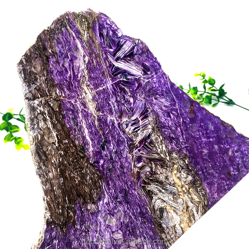 Polished purple charoite slice stone with silver-like crystal accents and layered texture