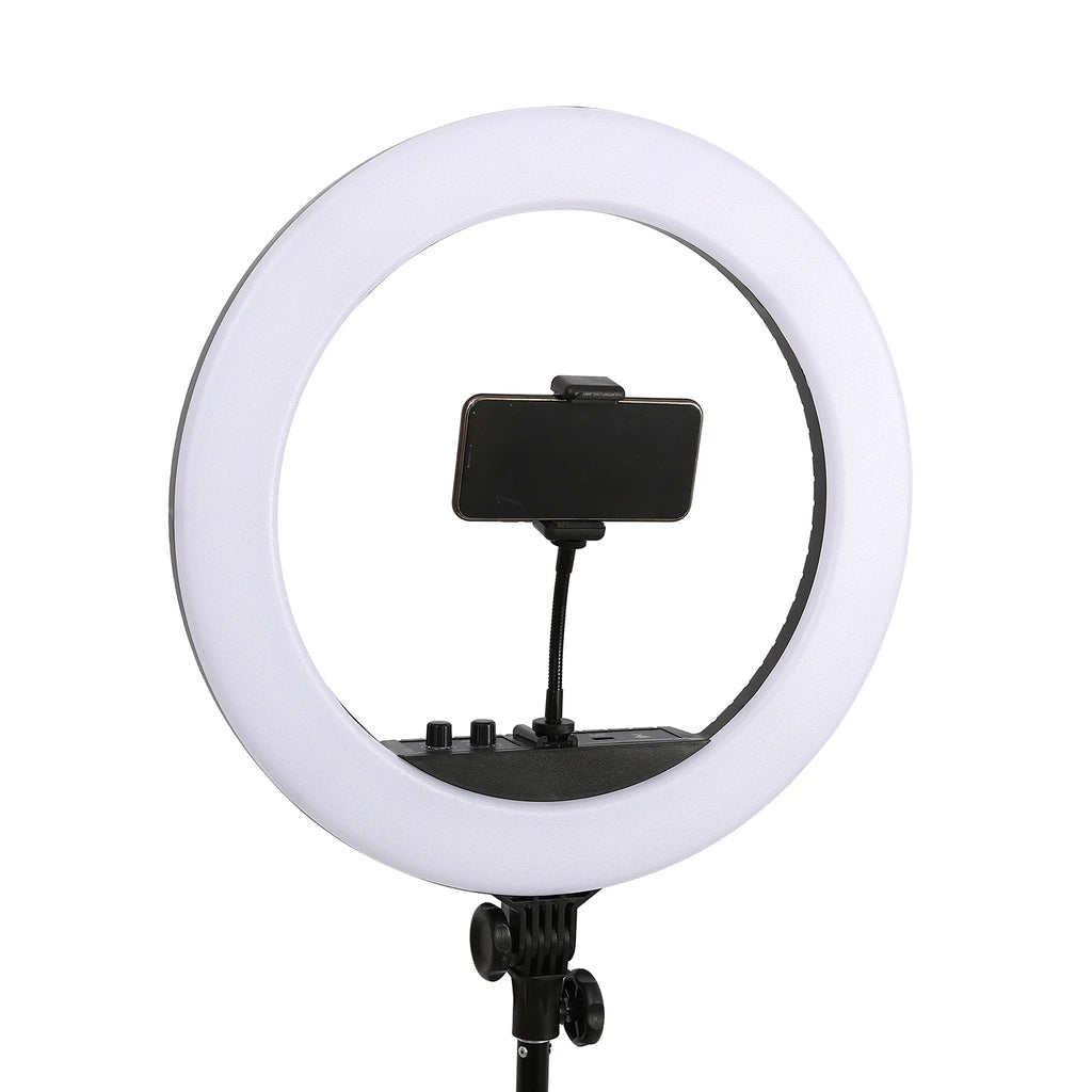 Large white circular LED ring light with a center smartphone mount on a stand for photography and video recording.