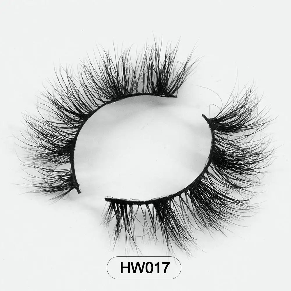 Voluminous black 3D mink false eyelashes arranged in a curve, featuring an ultra-soft thin band. Model label: HW017.