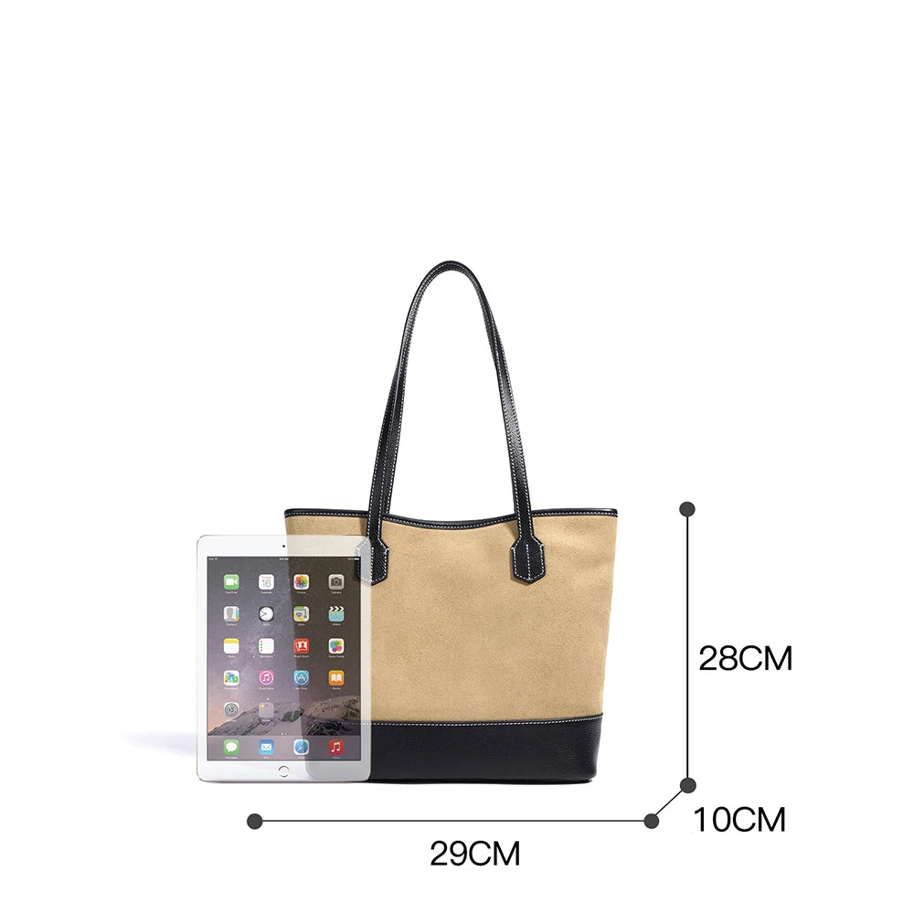 Vintage style tan suede and black leather underarm tote bag with minimalist design and tablet size scale reference.
