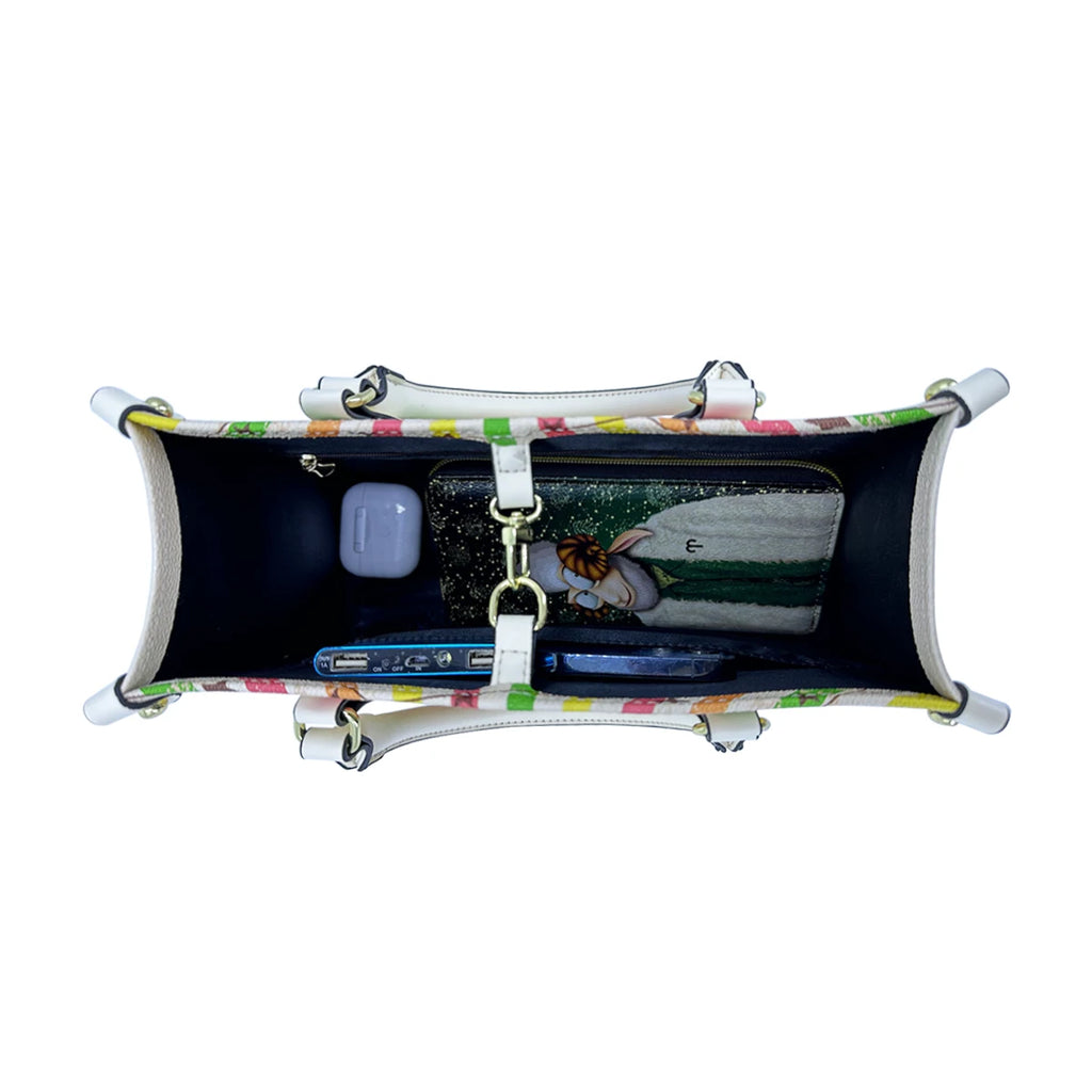 Top view of vintage PU leather trunk bag featuring a colorful patterned exterior, buckle closure, and spacious interior.