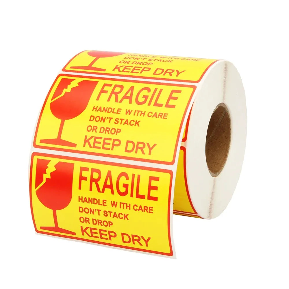 Fragile shipping label roll on yellow top panels with keep-dry and handle-with-care text