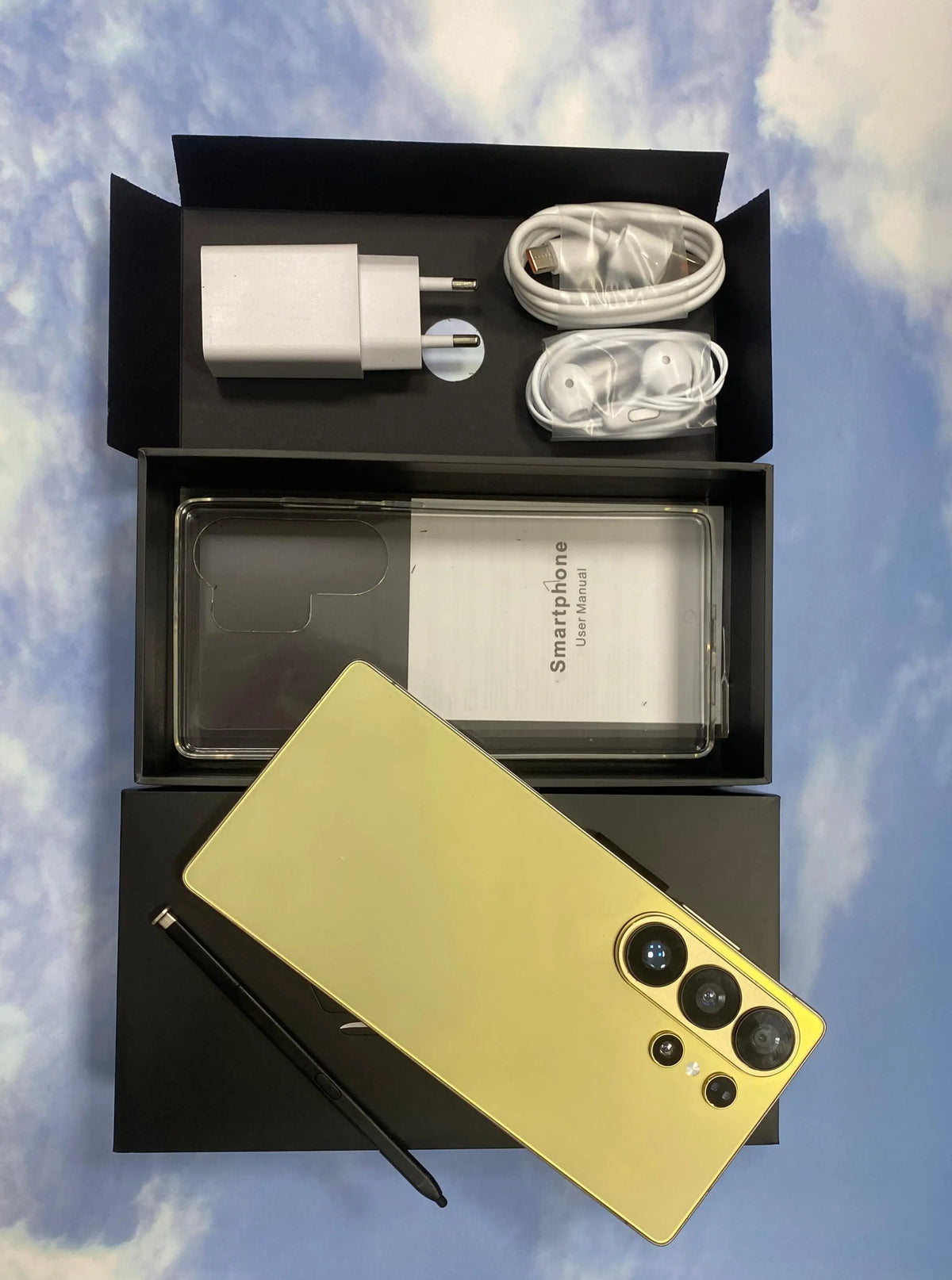 S26 Ultra phone in pale yellow with triple rear cameras, retail box contents shown.