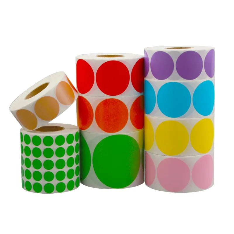 Assorted label rolls with red, purple, green, and yellow circular stickers