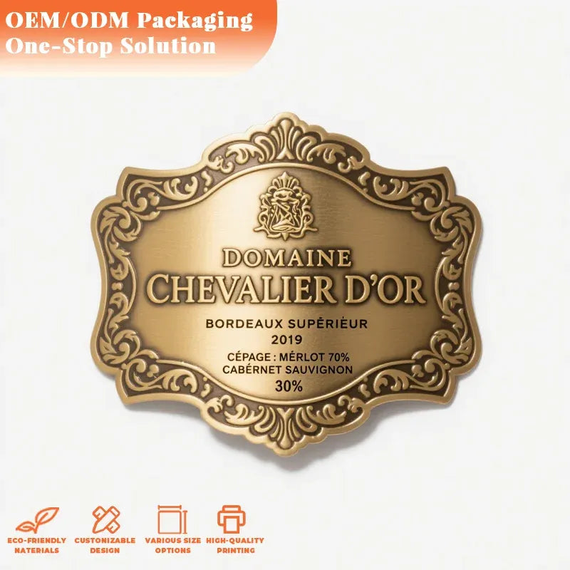 Bronze-gold ornate shield bottle label with raised border and Domaine Chevalier d’Or text