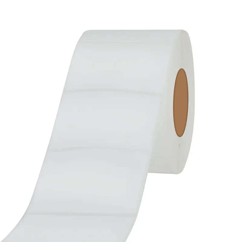 White label roll with blank tape and brown inner core, angled view.