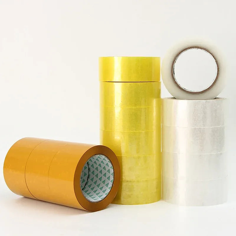 Stack of packing tape rolls: yellow, white, and amber with printed cores