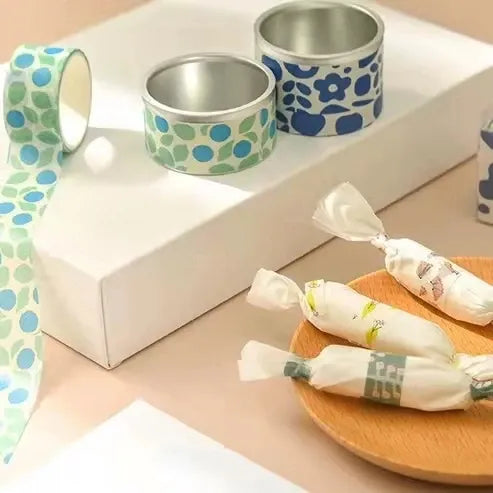 Washi tape rolls with blue and green geometric and animal prints