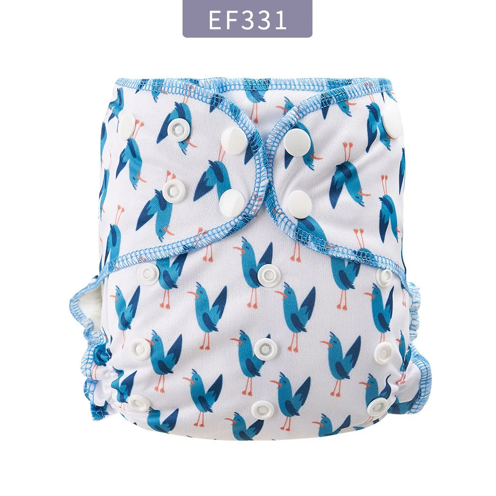 Reusable baby cloth diaper with blue bird print, adjustable snap closure, one-size baby care essential.