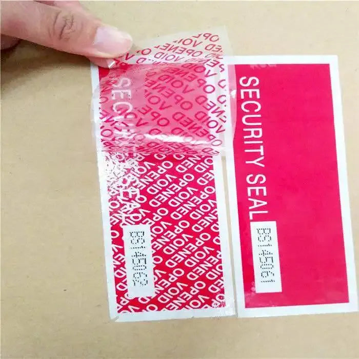 Red tamper-evident sealing tape applied to cardboard with SECURITY SEAL label panel