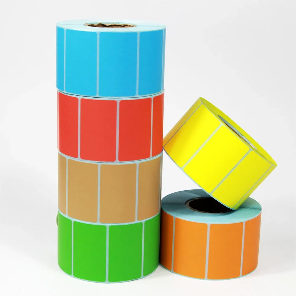 Stack of rolls with blue, red, tan, and green label sticker sheets