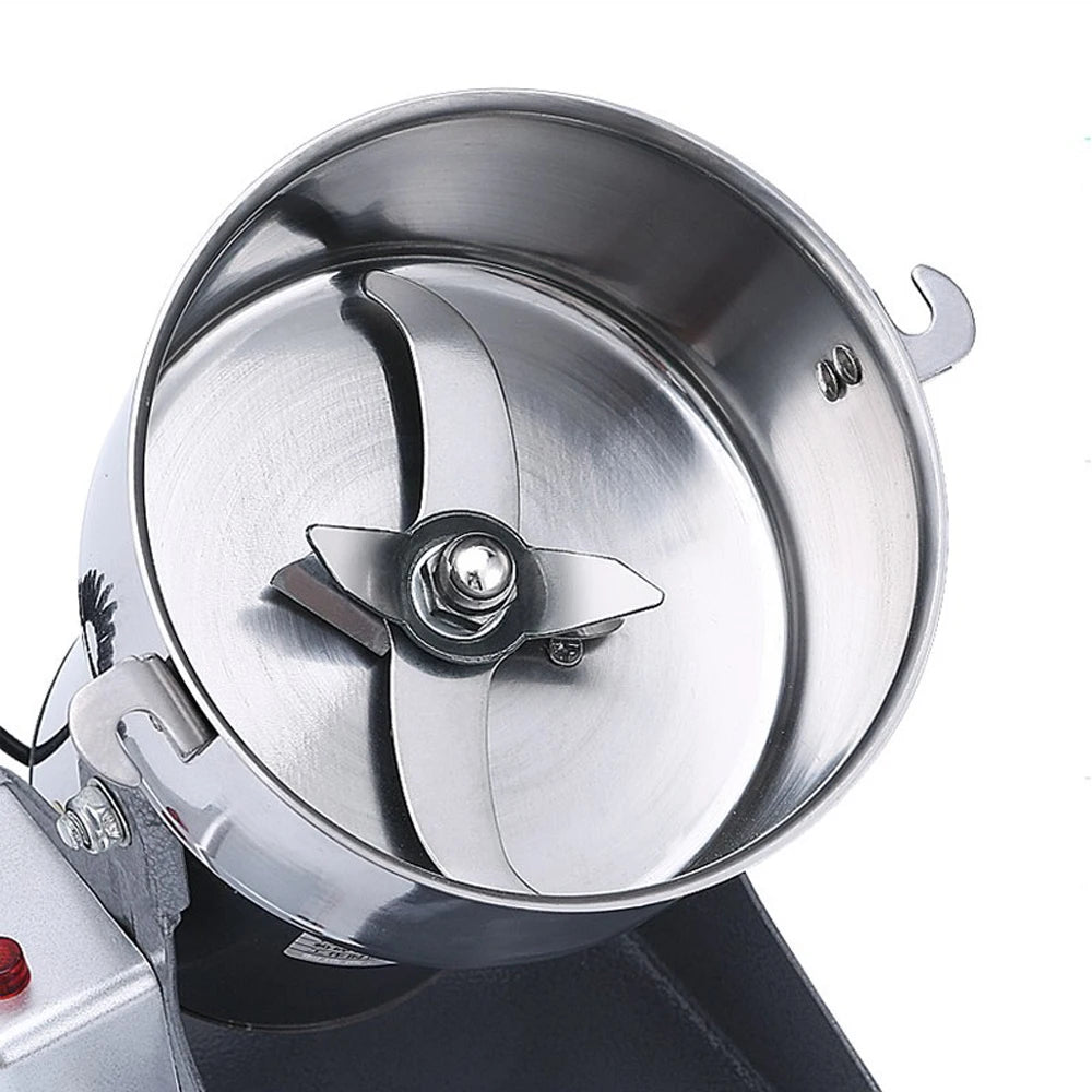 Stainless steel electric coffee bean and spice grinder with high-speed sharp metal blades for precision grinding.