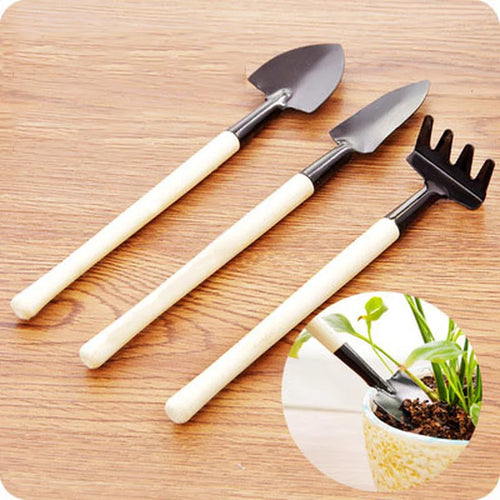 3-piece mini gardening tool set with black metal heads and light wood handles