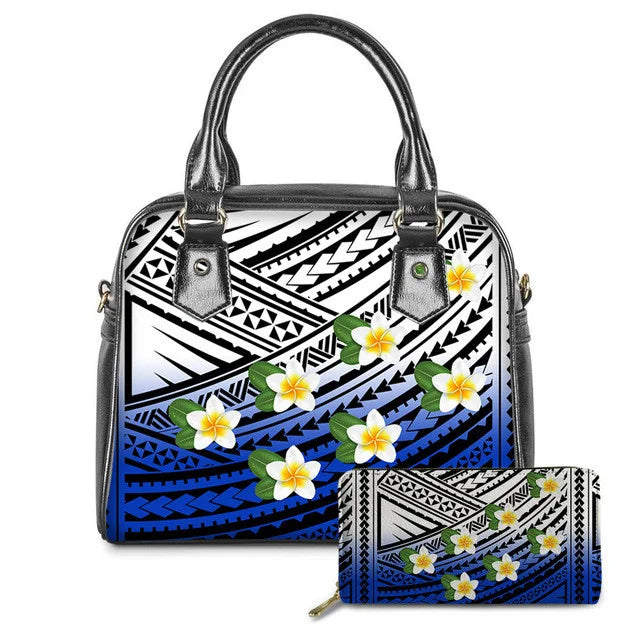 Blue and white Polynesian tribal print leather handbag and matching wallet set with colorful plumeria floral design.