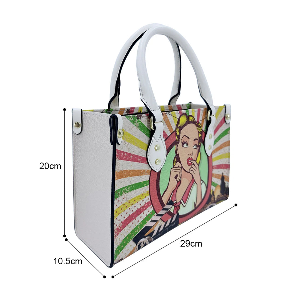 Small white faux leather trunk handbag with colorful retro pop-art comic girl print and dual carry handles.