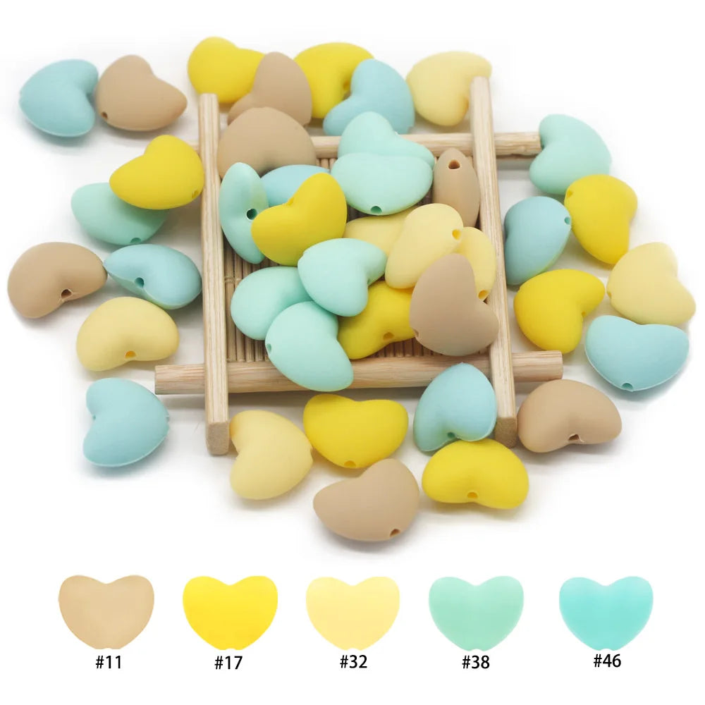 Multi-color silicone heart teething toy beads for baby teething relief.