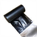 Black thermal transfer ribbon roll with open backing film and core