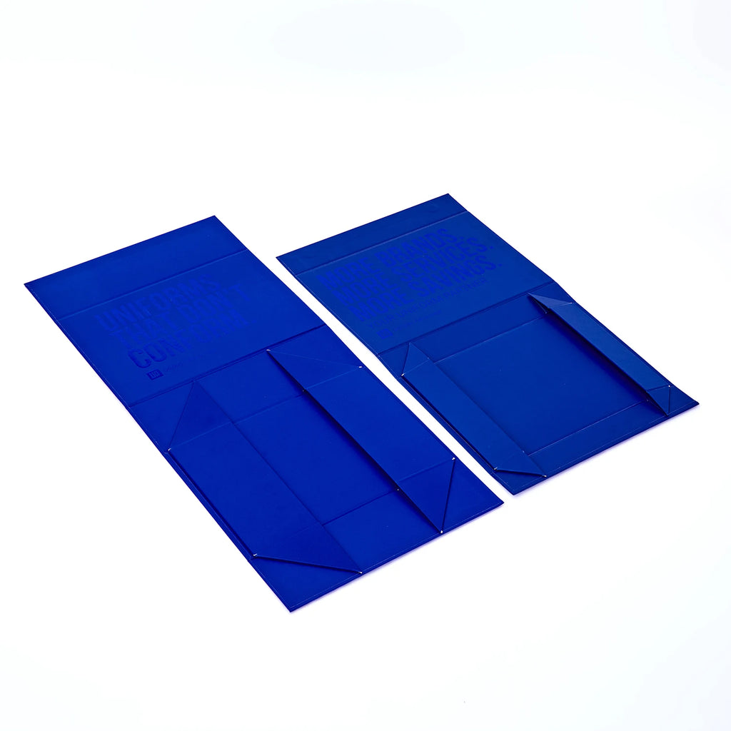 Blue corrugated mailer box with open flaps, folded packaging panels shown.