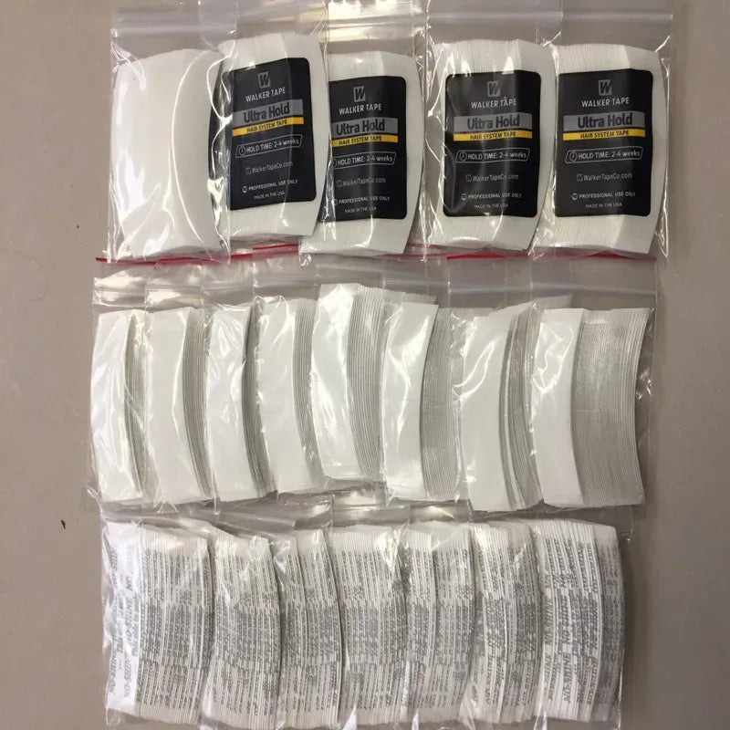 Walker Tape ultra hold adhesive tapes in clear packs, white strips