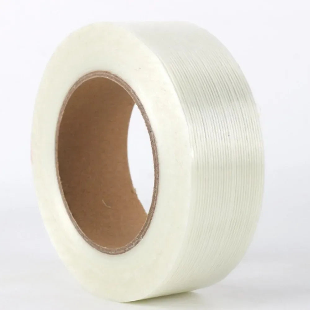 Cream-white cross-fiber filament tape roll with brown cardboard core, single-sided adhesive