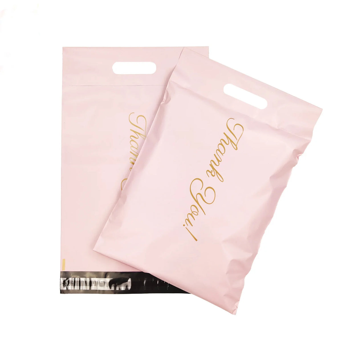 Pink plastic mailer bags with cut-out handles and gold script logo print.