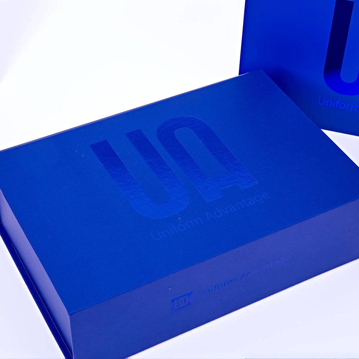 Blue corrugated mailer box with custom logo on lid, close-up view from above.