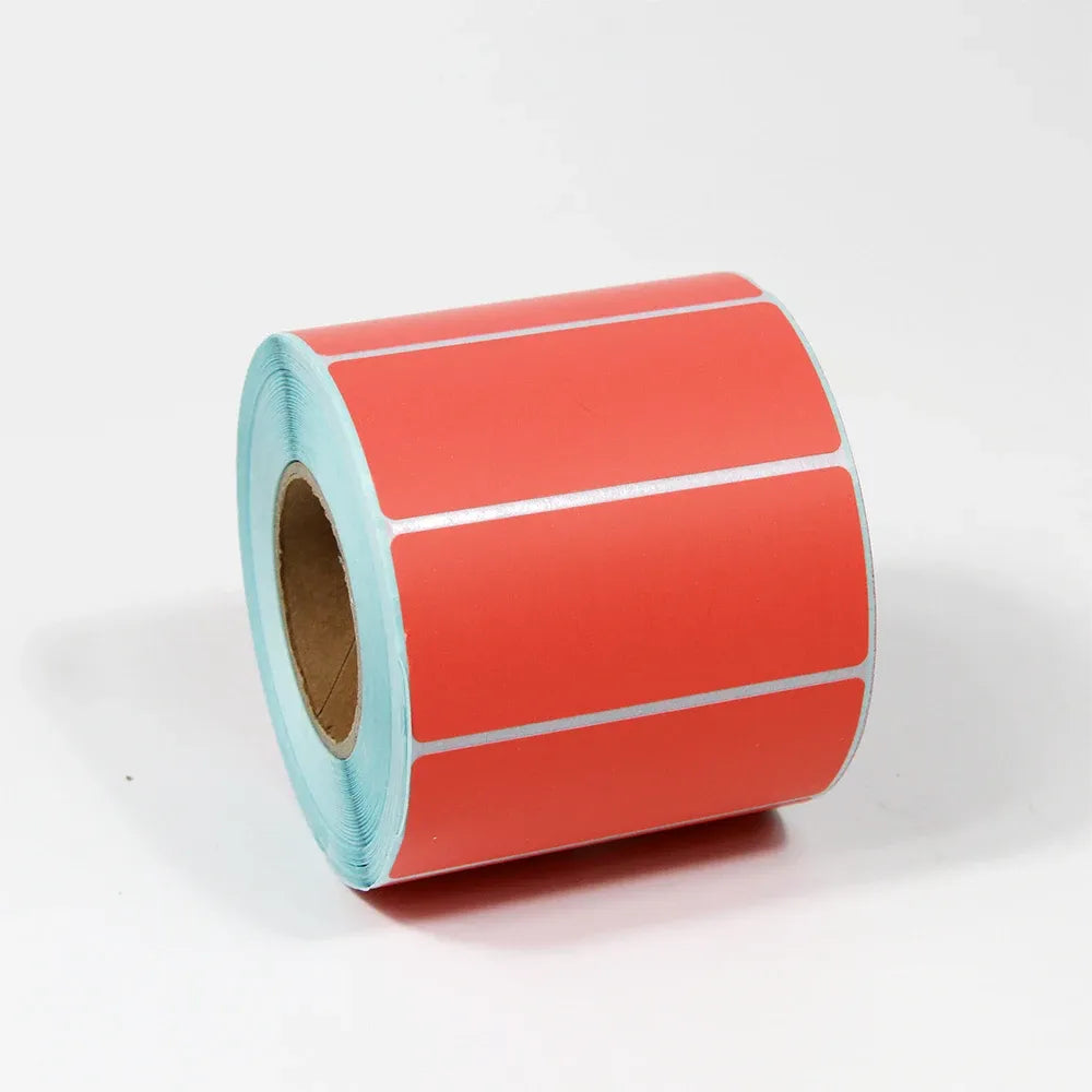 Red self-adhesive thermal label stock roll with blank rectangular labels