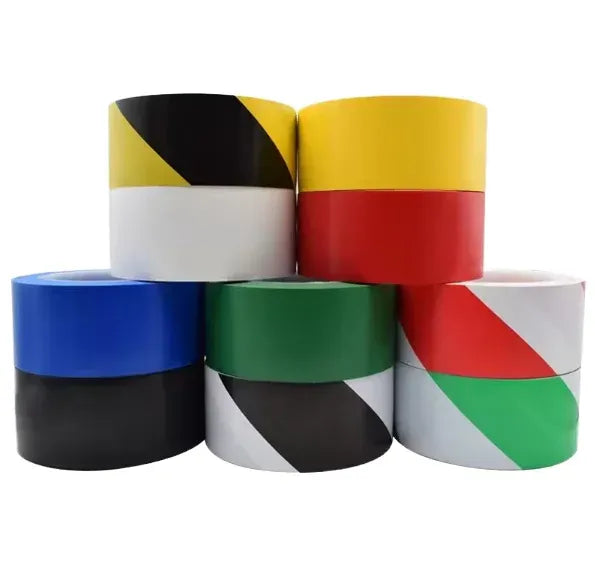 Water-activated PVC striped warning tape rolls in mixed yellow, black, red, and green.