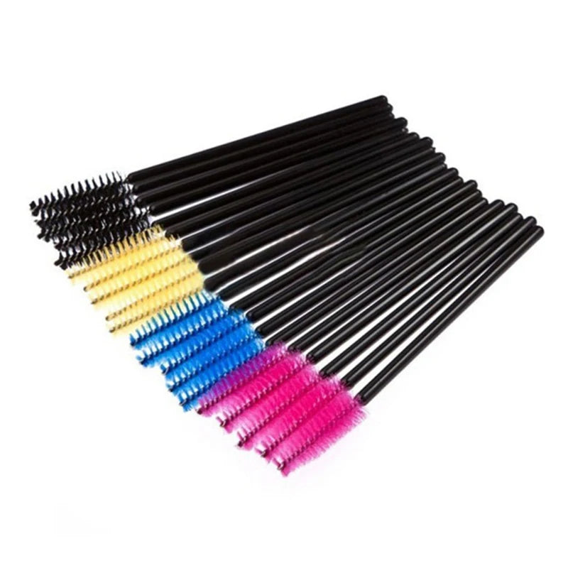 Disposable mascara wands with black plastic handles and colorful nylon bristle heads in black, gold, blue, and pink.