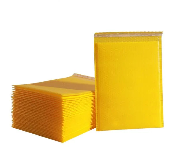 Stack of yellow poly bubble mailer-style shipping bags with sealed flap
