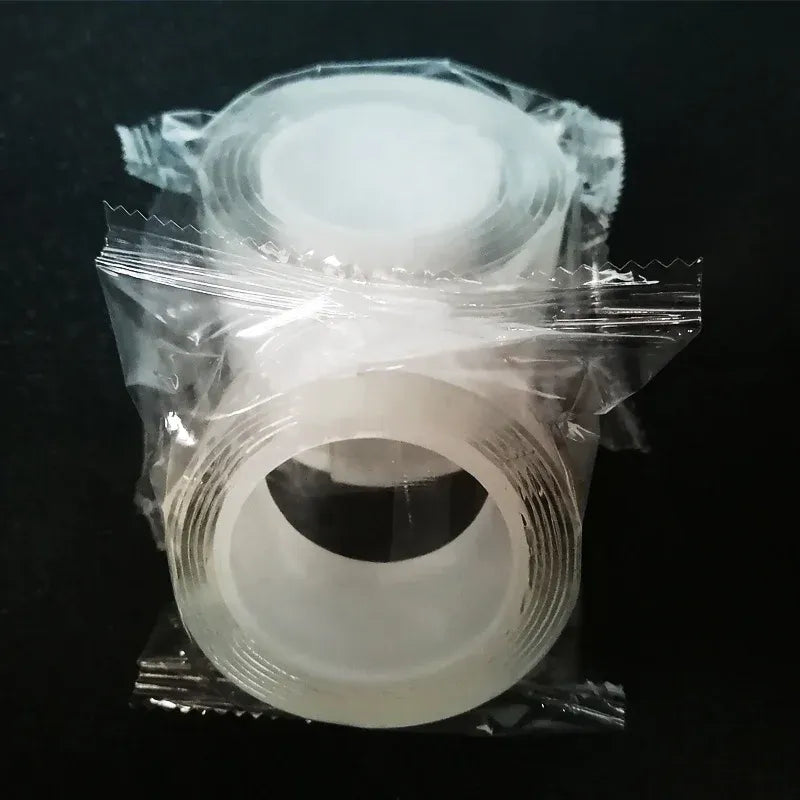 White double-sided nano tape roll sealed in plastic sleeve, tight circular coil