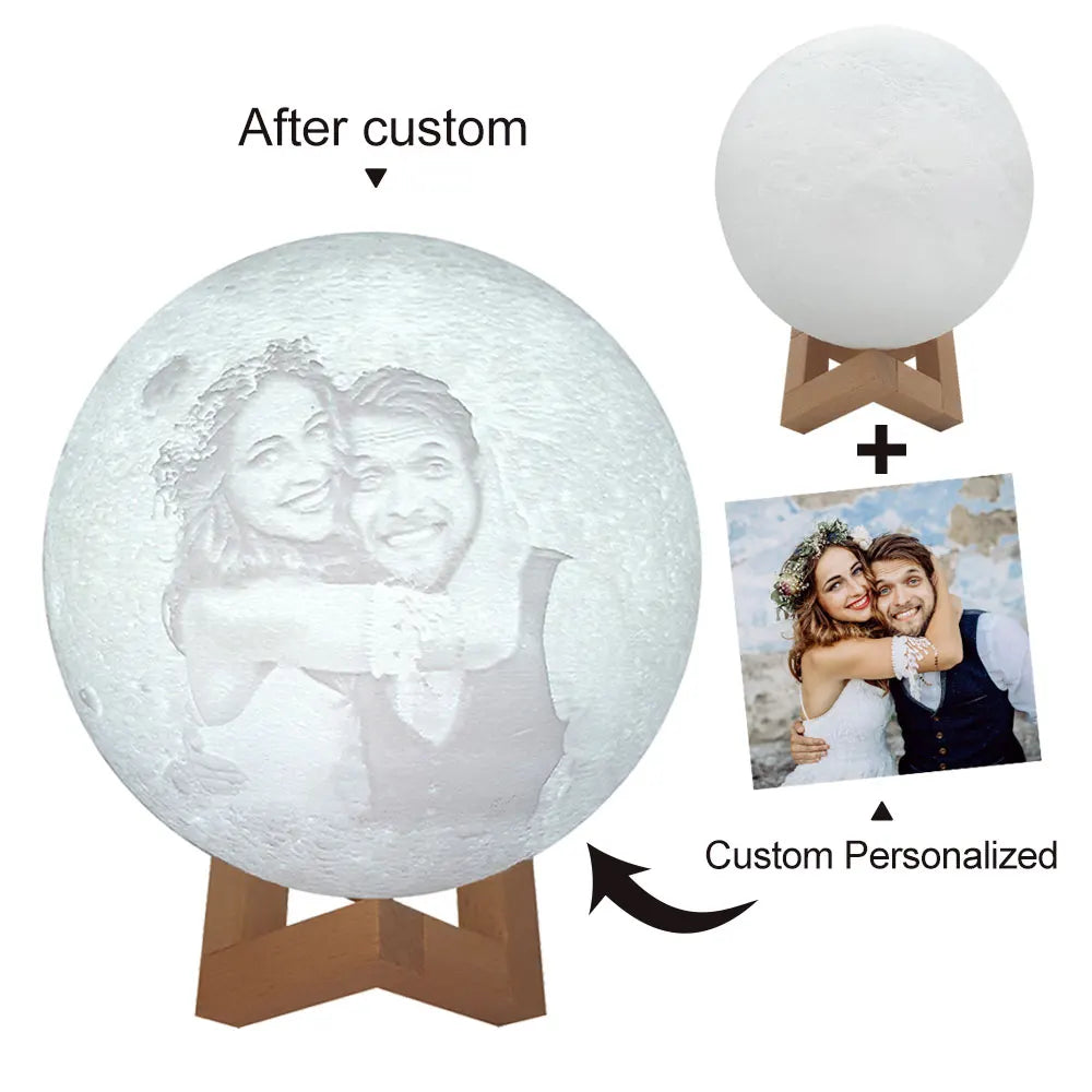 Custom 3D-printed moon lamp on a wooden stand, featuring an engraved portrait of a couple.