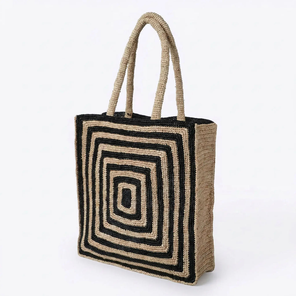 Black and beige woven crochet tote bag with geometric square pattern, lightweight straw-style beach handbag.