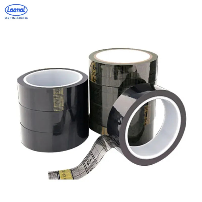 Multiple black conductive ESD tape rolls with gray and yellow grid print strip