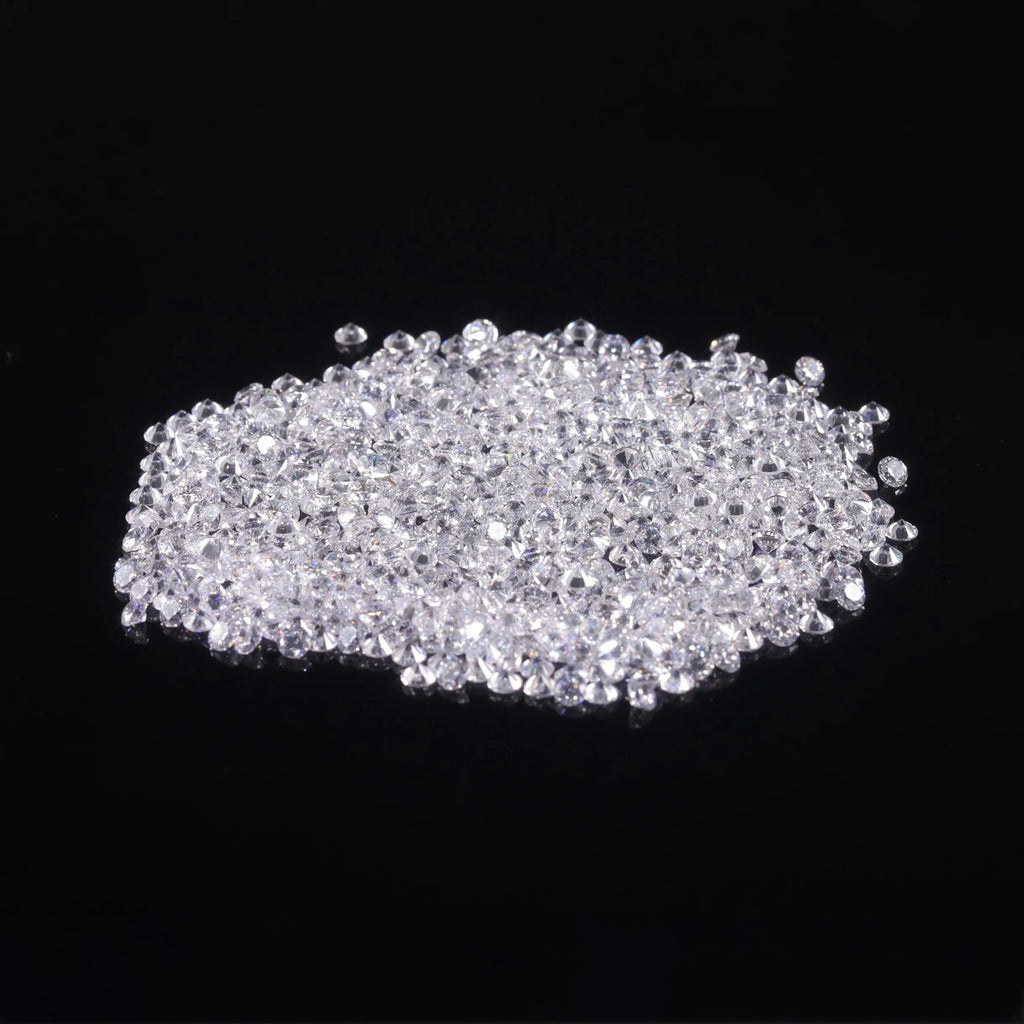 Loose round brilliant lab-grown diamonds in a compact pile of small stones