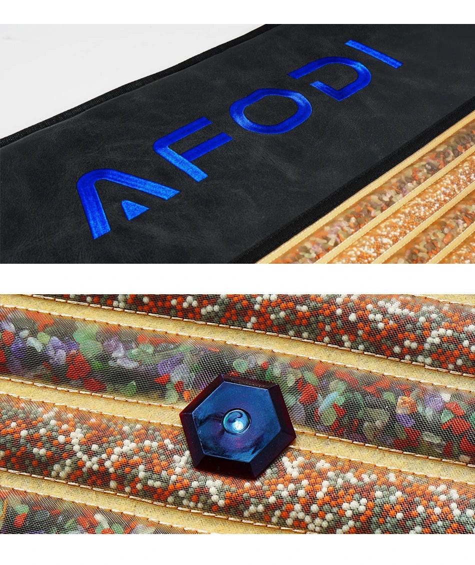 Infrared heating mat with black leather, gemstone-filled mesh channels, and a hexagonal control button.