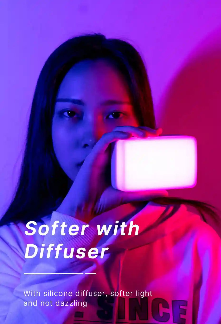 Handheld rectangular LED video light with a white silicone diffuser for soft, non-glaring lighting.