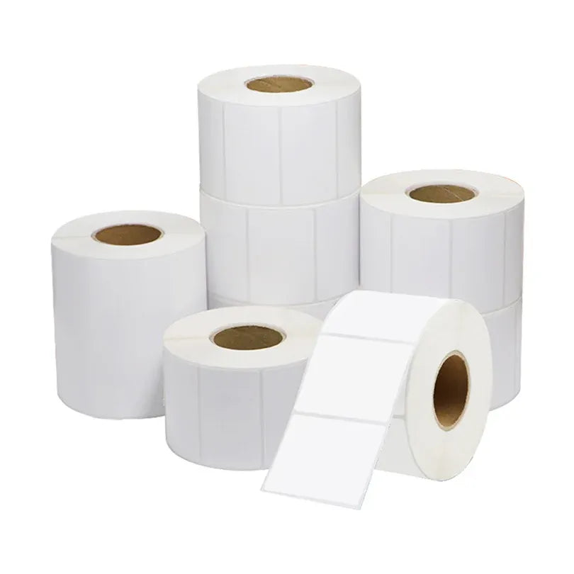 White glossy self-adhesive label paper roll, multiple rolls with visible cores