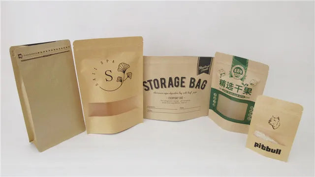 Paper storage bags and pouches on a tabletop, including Kraft-style packaging