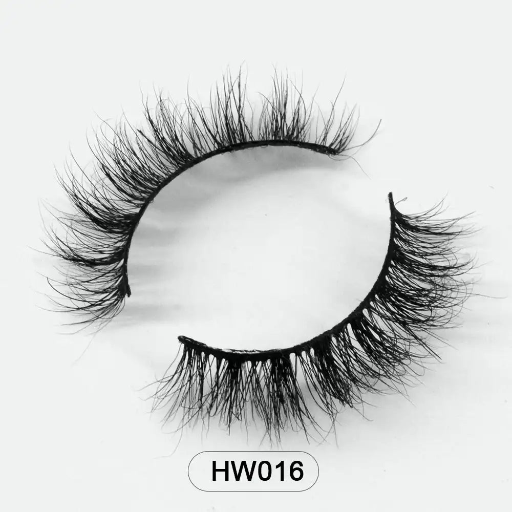 A pair of wispy, black 3D mink false eyelashes with a flexible band, shown on a white background. Model label: HW016.